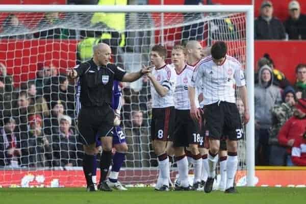 MANCHESTER, ENGLAND - Sunday, January 9, 2011: Referee Howard Webb waves off Liverpool protests as he is eager to give Manchester United a penalty in the opening minutes during the FA Cup 3rd Round match against Liverpool at Old Trafford. (Photo by: David Rawcliffe/Propaganda)