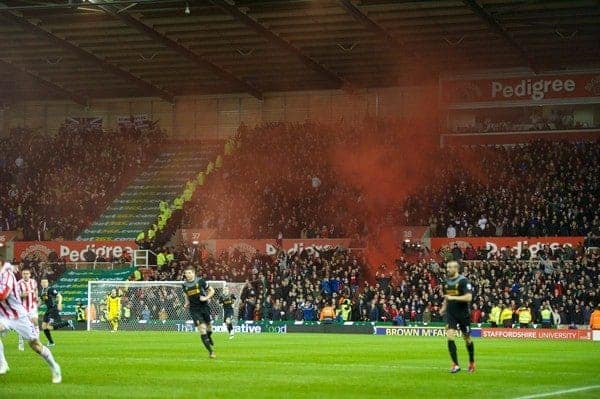 STOKE-ON-TRENT, ENGLAND - Boxing Day Wednesday, December 26, 2012: Liverpool supporters set off a red smoke bomb as they celebrate Luis Alberto Suarez Diaz winning a penalty against Stoke City during the Premiership match at the Britannia Stadium. (Pic by David Rawcliffe/Propaganda)