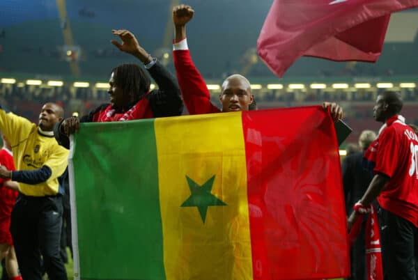 CARDIFF, WALES - Sunday, March 2, 2003: Liverpool's Senegal stars Salif Diao (l) and El-Hadji Diouf celebrate with a Senegal flag after their 2-0 victory over Manchester United during the Football League Cup Final at the Millennium Stadium. (Pic by David Rawcliffe/Propaganda)