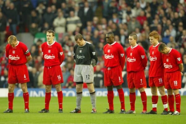 LIVERPOOL, ENGLAND - Saturday, January 10, 2004: Liverpool players stand for a moments silence in memory a club scout against Aston Villa during the Premiership match at Anfield. Igor Biscan, Sami Hyypia, Dietmar Hamman, goalkeeper Paul Jones, Emile Heskey, Harry Kewell, John Arne Riise, Michael Owen. (Photo by David Rawcliffe/Propaganda)