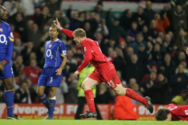 LIVERPOOL, ENGLAND- SUNDAY NOVEMBER 28th 2004: Liverpool's Neil Mellor celebrates scoring the winning goal in injury time as Arsenal players (L-R) Sol Campbell, Ashley Cole and Patrick Vieira look on dejected during the Premiership match at Anfield. (Pic by David Rawcliffe/Proparganda)