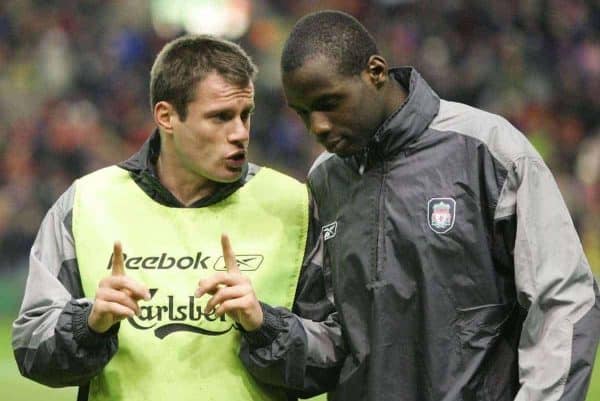 LIVERPOOL, ENGLAND - TUESDAY JANUARY 11th 2005: Liverpool's Jamie Carragher chats with team-mate Djimi Traore before the League Cup Semi-Final 1st Leg at Anfield. (Pic by David Rawcliffe/Propaganda)