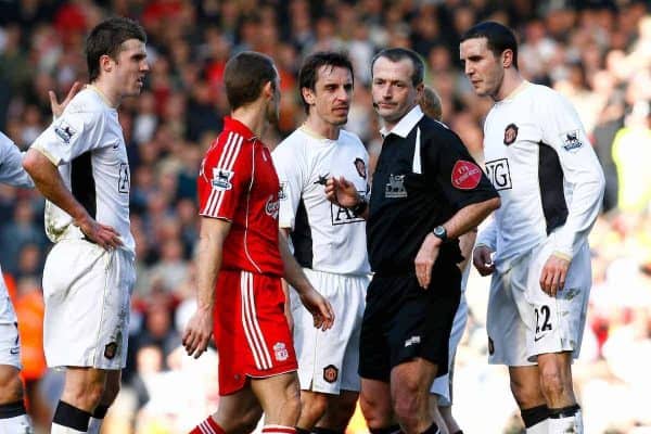 Liverpool, England - Saturday, March 3, 2007:  Manchester United players Michael Carrick, Gary Neville and John O'Shea surround the referee, as is their custom when a decision goes against them, after he sent off Paul Scholes for an assault on Liverpool's Xabi Alonso during the Premiership match at Anfield. (Pic by David Rawcliffe/Propaganda)