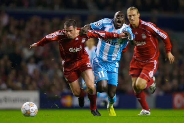Liverpool, England - Wednesday, October 3, 2007: Liverpool's Jamie Carragher and Olympique de Marseille's Mamadou Niang during the UEFA Champions League Group A match at Anfield. (Photo by David Rawcliffe/Propaganda)