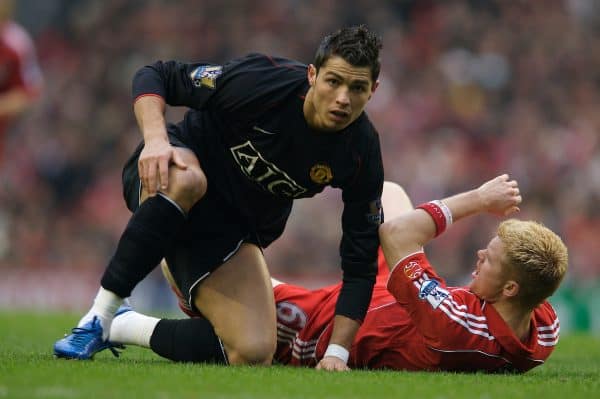 LIVERPOOL, ENGLAND - Sunday, December 16, 2007: Liverpool's John Arne Riise brought down by Manchester United's Cristiano Ronaldo during the Premiership match at Anfield. (Photo by David Rawcliffe/Propaganda)