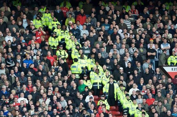 MANCHESTER, ENGLAND - Sunday, March 23, 2008: Liverpool fans are protected from the Manchester United fans by stewards and police during the Premiership match at Old Trafford. (Photo by David Rawcliffe/Propaganda)