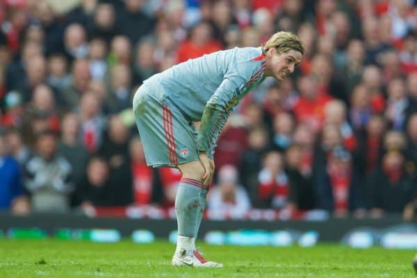 MANCHESTER, ENGLAND - Saturday, March 14, 2009: Liverpool's Fernando Torres takes a knock during the Premiership match against Manchester United at Old Trafford. (Photo by David Rawcliffe/Propaganda)