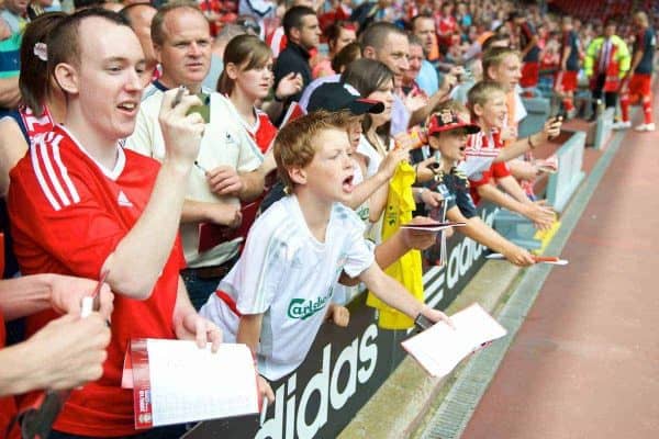 LIVERPOOL, ENGLAND - Saturday, August 8, 2009: Young Liverpool supporters wait for an autograph from a player before a pre-season friendly match against Club Atletico de Madrid at Anfield. (Pic by: David Rawcliffe/Propaganda)