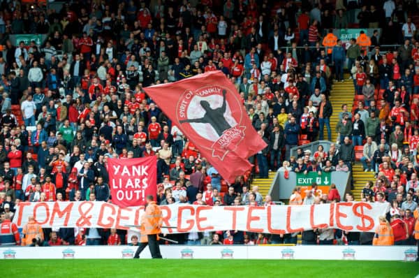 LIVERPOOL, ENGLAND - Saturday, September 26, 2009: Liverpool's supporters on the Spion Kop display banners reading "YANK LIARS OUT!" and "TOM AND GEORGE TELL LIES" regarding the many broken promises made by American co-owners Tom Hicks and George Gillett, before the Premiership match against Hull City at Anfield. (Photo by: David Rawcliffe/Propaganda)