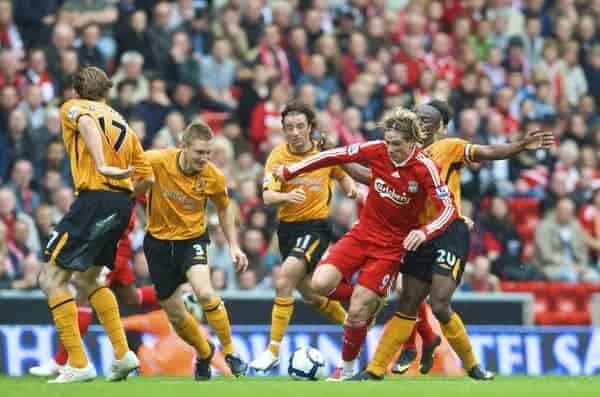 LIVERPOOL, ENGLAND - Saturday, September 26, 2009: Liverpool's Fernando Torres is chased by Hull City's Kevin Kilbane, Andy Dawson, Stephen Hunt and George Boateng during the Premiership match at Anfield. (Photo by: David Rawcliffe/Propaganda)