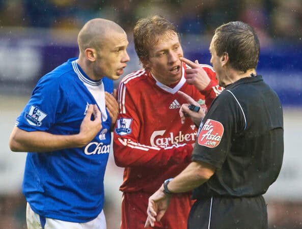 LIVERPOOL, ENGLAND - Sunday, November 29, 2009: Liverpool's Lucas Leiva points to his blood stained face as Everton's John Heitinga protests to referee Alan Wiley during the Premiership match at Goodison Park. The 212th Merseyside Derby. (Photo by David Rawcliffe/Propaganda)