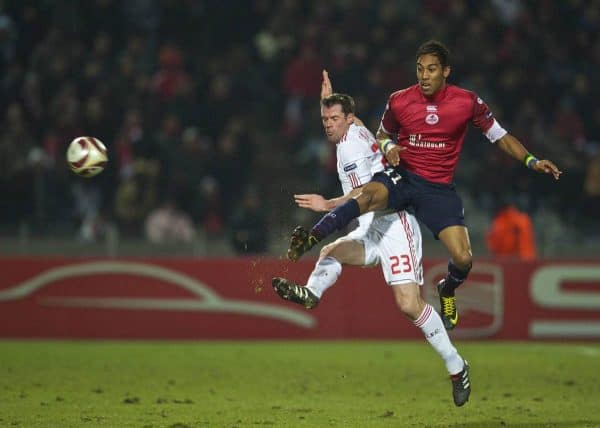 LILLE, FRANCE - Thursday, March 11, 2010: Liverpool's Jamie Carragher and LOSC Lille Metropole's Pierre-Emerick Aubameyang during the UEFA Europa League Round of 16 1st Leg match at the Stadium Lille-Metropole. (Photo by David Rawcliffe/Propaganda)