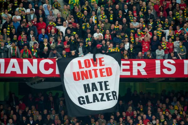 MANCHESTER, ENGLAND - Sunday, March 21, 2010: Manchester United's supporters unfurl a banner in protest against owner Malcolm Glazer during the Premiership match against Liverpool at Old Trafford. (Photo by: David Rawcliffe/Propaganda)