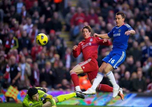 LIVERPOOL, ENGLAND - Sunday, November 7, 2010: Liverpool's Fernando Torres breezes past Chelsea's captain John Terry to score his side's opening goal during the Premiership match at Anfield. (Photo by David Rawcliffe/Propaganda)