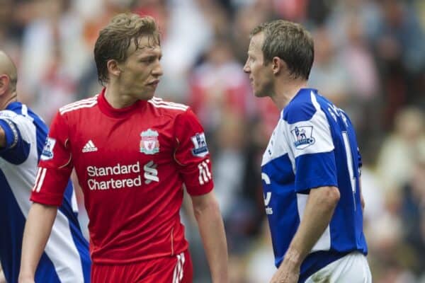 LIVERPOOL, ENGLAND - Saturday, April 23, 2011: Liverpool's Lucas Leiva clashes with Birmingham City's Lee Bowyer during the Premiership match at Anfield. (Photo by David Rawcliffe/Propaganda)