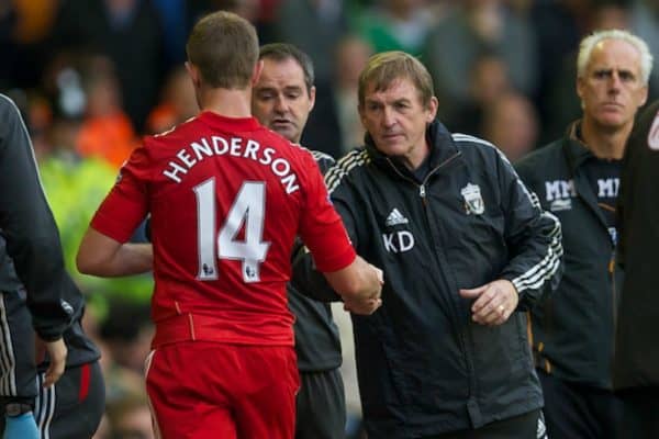 LIVERPOOL, ENGLAND - Saturday, September 24, 2011: Liverpool's manager Kenny Dalglish shakes hands with Jordan Henderson as he is substituted against Wolverhampton Wanderers during the Premiership match at Anfield. (Pic by David Rawcliffe/Propaganda)