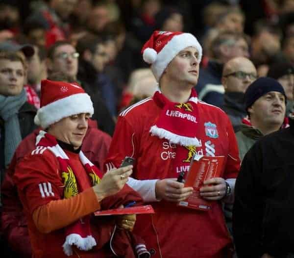 LIVERPOOL, ENGLAND - Saturday, December 10, 2011: Liverpool supporters in festive Santa hats during the Premiership match against Queens Park Rangers at Anfield. (Pic by David Rawcliffe/Propaganda)