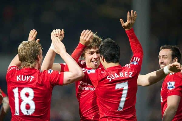 LONDON, ENGLAND - Wednesday, March 21, 2012: Liverpool's Sebastian Coates celebrates scoring his first ever goal for the club, with team-mates Dirk Kuyt and Luis Alberto Suarez Diaz, during the Premiership match against Queens Park Rangers at Loftus Road. (Pic by David Rawcliffe/Propaganda)