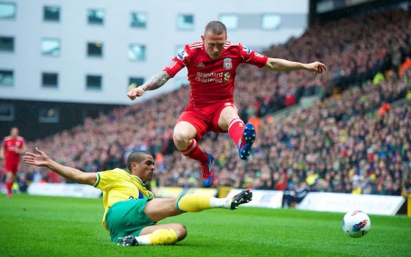 NORWICH, ENGLAND - Saturday, April 28, 2012: Liverpool's Craig Bellamy in action against Norwich City's Kyle Naughton during the Premiership match at Carrow Road. (Pic by David Rawcliffe/Propaganda)