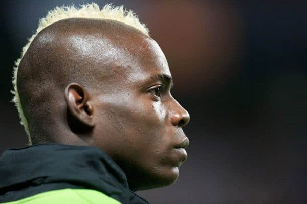 MANCHESTER, ENGLAND - Monday, April 30, 2012: Manchester City's Mario Balotelli shows off his new hair style, a Mohican dyed yellow, as he warms-up as an unused substitute during the Premiership match against Manchester United at the City of Manchester Stadium. (Pic by David Rawcliffe/Propaganda)