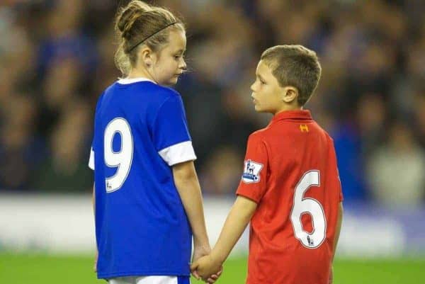 LIVERPOOL, ENGLAND - Monday, September 17, 2012: Mascots Beth Garner-Watt, 11, and Mikey Clarke, 8, stand for a minute's applause to remember the 96 victims of the Hillsborough Stadium Disaster before the Premiership match between Everton and Newcastle United at Goodison Park. (Pic by David Rawcliffe/Propaganda)