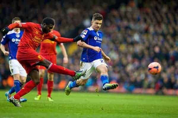 LIVERPOOL, ENGLAND - Sunday, January 5, 2014: Liverpool's Kolo Toure in action against Oldham Athletic's Michael Petrasso during the FA Cup 3rd Round match at Anfield. (Pic by David Rawcliffe/Propaganda)