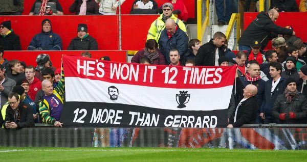 MANCHESTER, ENGLAND - Sunday, January 13, 2013: Manchester United fans' banner 'He's [Ryan Giggs] Won It 12 Times More Than Gerrard' during the Premiership match at Old Trafford. (Pic by David Rawcliffe/Propaganda)