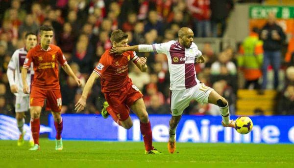 LIVERPOOL, ENGLAND - Saturday, January 18, 2014: Liverpool's captain Steven Gerrard and Aston Villa's Fabian Delph during the Premiership match at Anfield. (Pic by David Rawcliffe/Propaganda)