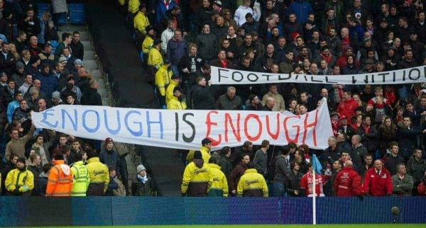 MANCHESTER, ENGLAND - Sunday, February 3, 2013: Liverpool fans protest against high ticket prices with a banner '£nough is £nough [Enough is Enough]' during the Premiership match against Manchester City at the City of Manchester Stadium. (Pic by David Rawcliffe/Propaganda)