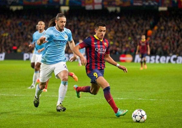 MANCHESTER, ENGLAND - Tuesday, February 18, 2014: Manchester City's Martin Demichelis in action against FC Barcelona's Alexis Sanchez during the UEFA Champions League Round of 16 match at the City of Manchester Stadium. (Pic by David Rawcliffe/Propaganda)