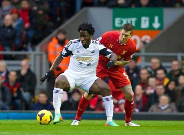 LIVERPOOL, ENGLAND - Sunday, February 23, 2014: Liverpool's Daniel Agger in action against Swansea City's Wilfried Bony during the Premiership match at Anfield. (Pic by David Rawcliffe/Propaganda)