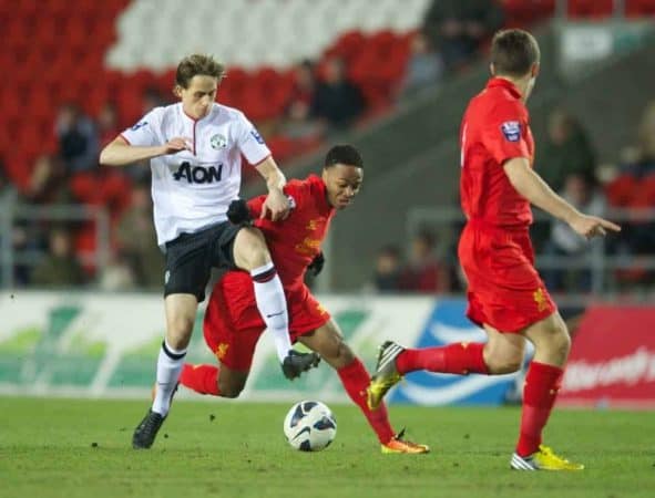 ST HELENS, ENGLAND - Monday, February 25, 2013: Liverpool's Raheem Sterling in action against Manchester United's Adnan Januzaj during the Premier League Academy match at Langtree Park. (Pic by David Rawcliffe/Propaganda)