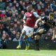 BIRMINGHAM, ENGLAND - Easter Sunday, March 31, 2013: Liverpool's captain Steven Gerrard in action against Aston Villa's Yacouba Sylla during the Premiership match at Villa Park. (Pic by David Rawcliffe/Propaganda)