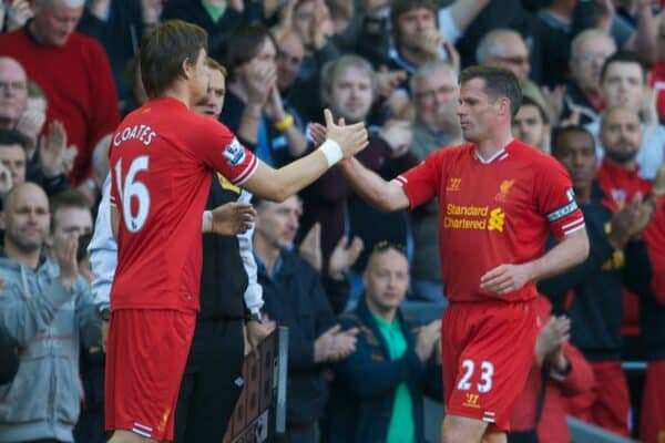 LIVERPOOL, ENGLAND - Sunday, May 19, 2013: Liverpool's Jamie Carragher shakes hands with Sebastian Coates as he is substituted in his 737th and last game for the club during the final Premiership match of the 2012/13 season against Queens Park Rangers at Anfield. (Pic by David Rawcliffe/Propaganda)