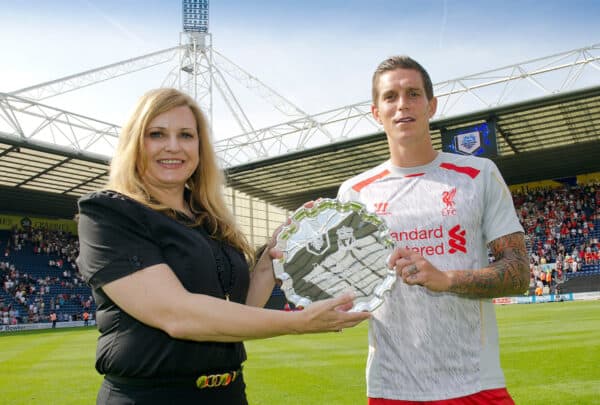 PRESTON, ENGLAND - Saturday, July 13, 2013: Liverpool's captain Daniel Agger receives the Bill Shankly Shield from a Preston North End official after his side's 4-0 victory during a preseason friendly match against Liverpool. (Pic by David Rawcliffe/Propaganda)