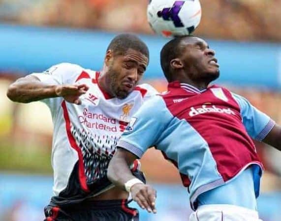 LIVERPOOL, ENGLAND - Saturday, August 24, 2013: Liverpool's Glen Johnson in action against Aston Villa's Christian Benteke during the Premiership match at Villa Park. (Pic by David Rawcliffe/Propaganda)