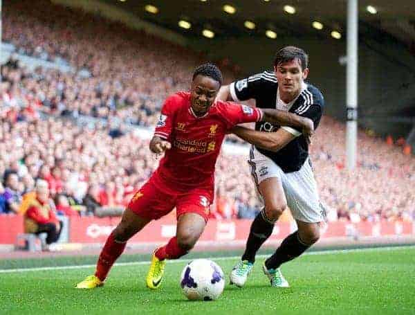 LIVERPOOL, ENGLAND - Saturday, September 21, 2013: Liverpool's Raheem Sterling and Southampton's Dejan Lovren during the Premiership match at Anfield. (Pic by David Rawcliffe/Propaganda)
