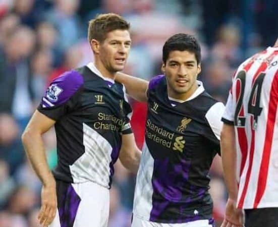 SUNDERLAND, ENGLAND - Sunday, September 29, 2013: Liverpool's Luis Suarez celebrates scoring the third goal against Sunderland with team-mate captain Steven Gerrard during the Premiership match at the Stadium of Light. (Pic by David Rawcliffe/Propaganda)