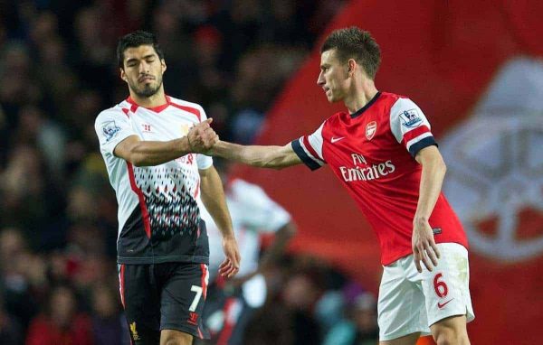 LONDON, ENGLAND - Saturday, November 2, 2013: Liverpool's Luis Suarez looks dejected as he shakes hands with Arsenal's Laurent Koscielny following his side's 2-0 defeat during the Premiership match at the Emirates Stadium. (Pic by David Rawcliffe/Propaganda)