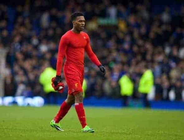 LIVERPOOL, ENGLAND - Saturday, November 23, 2013: Liverpool's Daniel Sturridge takes his shirt off to give to a supporter after his side's 3-3 draw with Everton during the 221st Merseyside Derby Premiership match at Goodison Park. (Pic by David Rawcliffe/Propaganda)