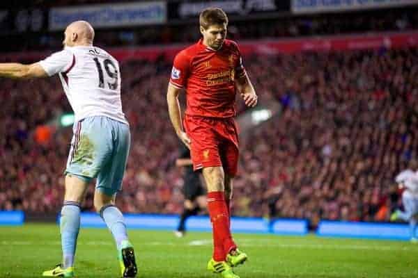 LIVERPOOL, ENGLAND - Saturday, December 7, 2013: Liverpool's captain Steven Gerrard pulls up injured against West Ham United during the Premiership match at Anfield. (Pic by David Rawcliffe/Propaganda)