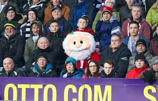 SWANSEA, WALES - Sunday, December 22, 2013: A happy looking Father Christmas looks on as Swansea City take on Everton during the Premiership match at the Liberty Stadium. (Pic by David Rawcliffe/Propaganda)