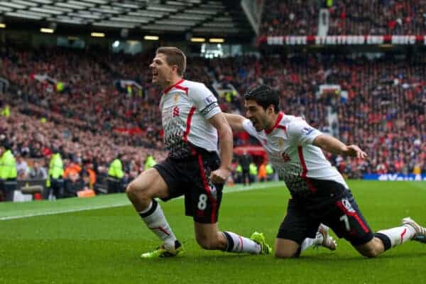 MANCHESTER, ENGLAND - Sunday, March 16, 2014: Liverpool's captain Steven Gerrard celebrates scoring the second goal against Manchester United from the penalty spot with team-mate Luis Suarez during the Premiership match at Old Trafford. (Pic by David Rawcliffe/Propaganda)