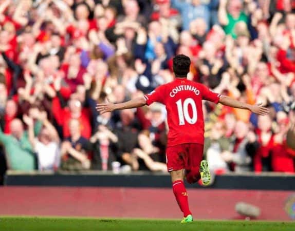 LIVERPOOL, ENGLAND - Sunday, March 30, 2014: Liverpool's Philippe Coutinho Correia celebrates scoring the third goal against Tottenham Hotspur during the Premiership match at Anfield. (Pic by David Rawcliffe/Propaganda)