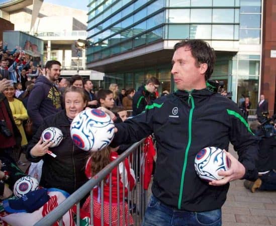 LIVERPOOL, ENGLAND - Thursday, April 10, 2014: Liverpool's Robbie Fowler hands out signed balls to the crowd at the launch of the new Warrior home kit for 2014/2015 at the Liverpool One shopping centre. (Pic by David Rawcliffe/Propaganda)