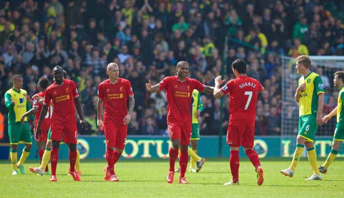 NORWICH, ENGLAND - Sunday, April 20, 2014: Liverpool's Glen Johnson celebrates his side's 3-2 victory over Norwich City with team-mate Luis Suarez during the Premiership match at Carrow Road. (Pic by David Rawcliffe/Propaganda)