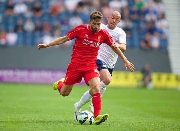 PRESTON, ENGLAND - Saturday, July 19, 2014: Liverpool's Fabio Borini in action against Preston North End's Keith Keane during a preseason friendly match at Deepdale Stadium. (Pic by David Rawcliffe/Propaganda)