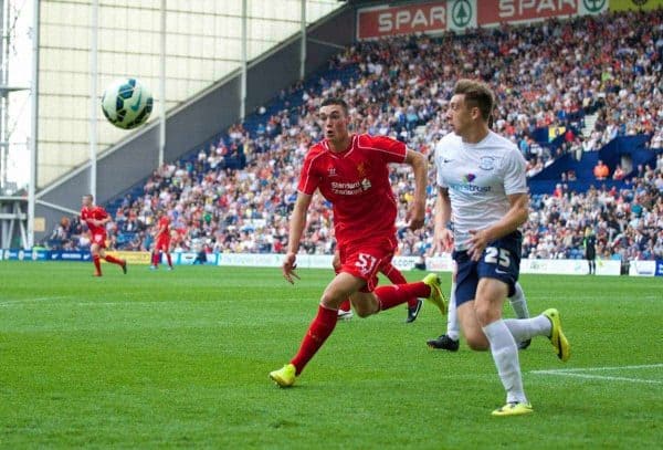 PRESTON, ENGLAND - Saturday, July 19, 2014: Liverpool's Lloyd Jones in action against Preston North End's Jordan Hugill during a preseason friendly match at Deepdale Stadium. (Pic by David Rawcliffe/Propaganda)