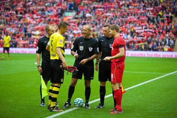 LIVERPOOL, ENGLAND - Sunday, August 10, 2014: Liverpool's captain Steven Gerrard and Borussia Dortmund's Sebastian Kehl during a preseason friendly match at Anfield. (Pic by David Rawcliffe/Propaganda)