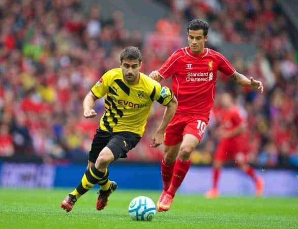 LIVERPOOL, ENGLAND - Sunday, August 10, 2014: Borussia Dortmund's Sokratis Papastathopoulos in action against Liverpool's Philippe Coutinho Correia during a preseason friendly match at Anfield. (Pic by David Rawcliffe/Propaganda)